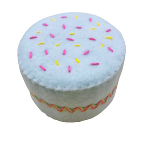 handcrafted felt small white cake with two pink flower decorations