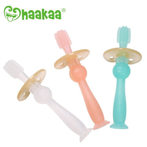 Haakaa 360 toothbrush made for infant and toddlers, shown in aqua blue