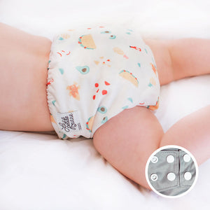 La Petite Ourse Pocket Cloth Diaper, shown on baby in llama print