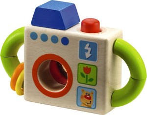HABA Capture Fun Camera is colorful with bright green handles and a red button that squeaks when pressed down