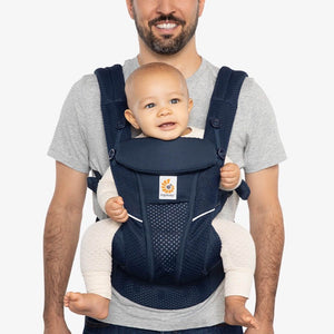 ergobaby omni breeze carrier in graphite grey with the ergo baby company logo