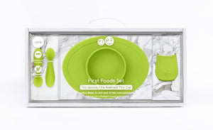 ezpz first food set in lime green includes; fork and spoon, tiny cup and tiny bowl mat