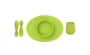 ezpz first food set in lime green includes; fork and spoon, tiny cup and tiny bowl mat