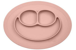coral ezpz all in one mini mat that suctions to a table or highchair with food in the 3 compartments before mealtime