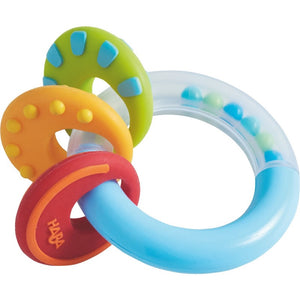 HABA Nobbi Clutching toy is red, yellow, green and blue and measure 3.5" in diameter