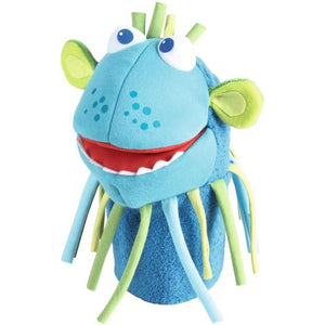 Turquoise blue with a silly smile and a string beard is the HABA Monster Momo Glove Puppet measures 10.5"