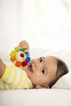 HABA Whirlygig wooden rattle and teether, rainbow colors with bell