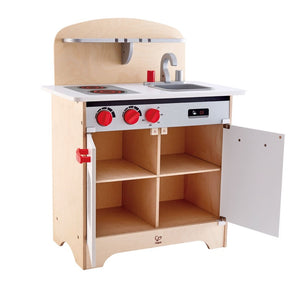Hape gourmet kitchen is just like home with, fridge, oven, turning red knobs, red handles, sink and water tap for ages 3+