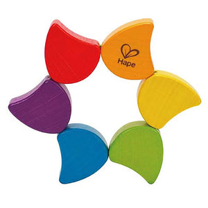 The Hape Rainbow Rattle pieces can be moved to form a different design
