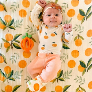 ritzy ritzy clementine teething ball is orange with a green  stem