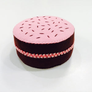 handmade in Ithaca, NY with felt is this delicious looking chocolate cake with pink frosting 