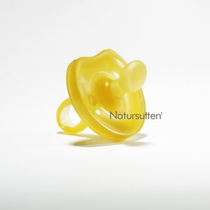 baby using a natursutten pacifier, close up of a pacifier and the Natursutten logo