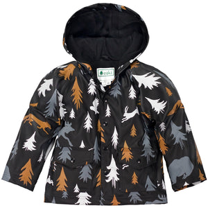 oaki wear lined raincoat in wildlife tracker print, black  background with  white, grey, and orange trees and wildlife silhouettes.