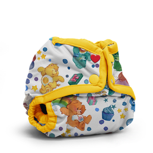 Rumparooz Newborn Snap closure diaper cover in Quinn print, blue, oranges, and brown plaid with the Rumparooz logo