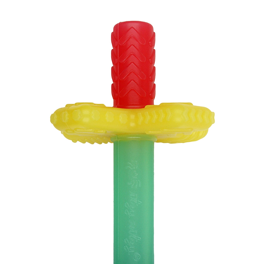 Colorful plastic teething tube with blue, green, yellow, and red sections on a white background