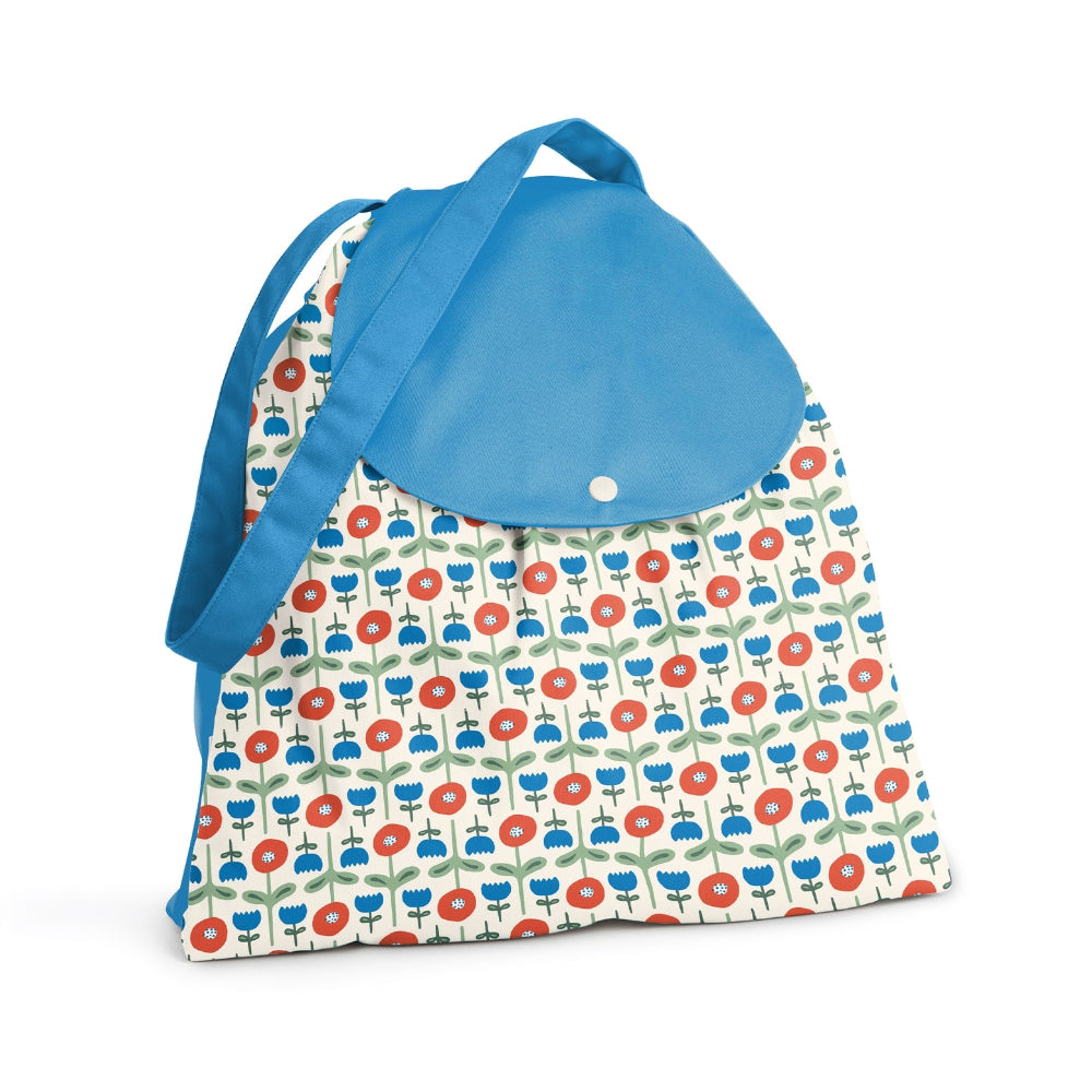 Esembly brand reusable wet bag with 2 compartments and strap, shown in poppies print with blue strap and flap