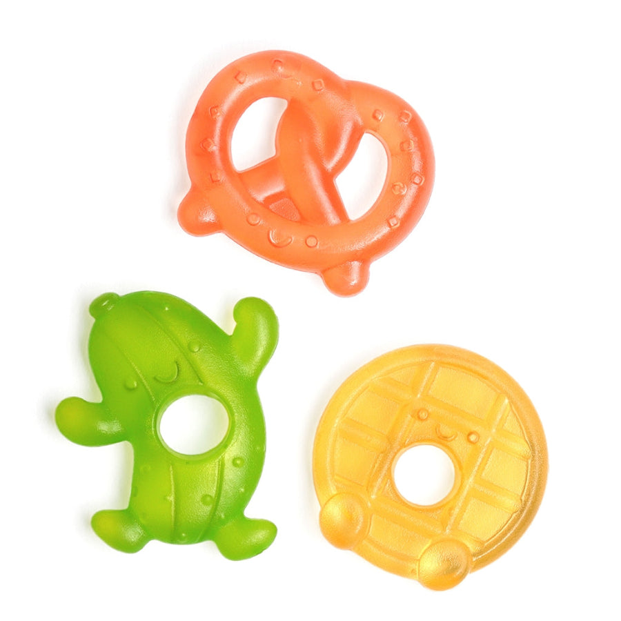 Three colorful baby teething rings in silly food shapes on a white background, made by Itzy Ritzy brand