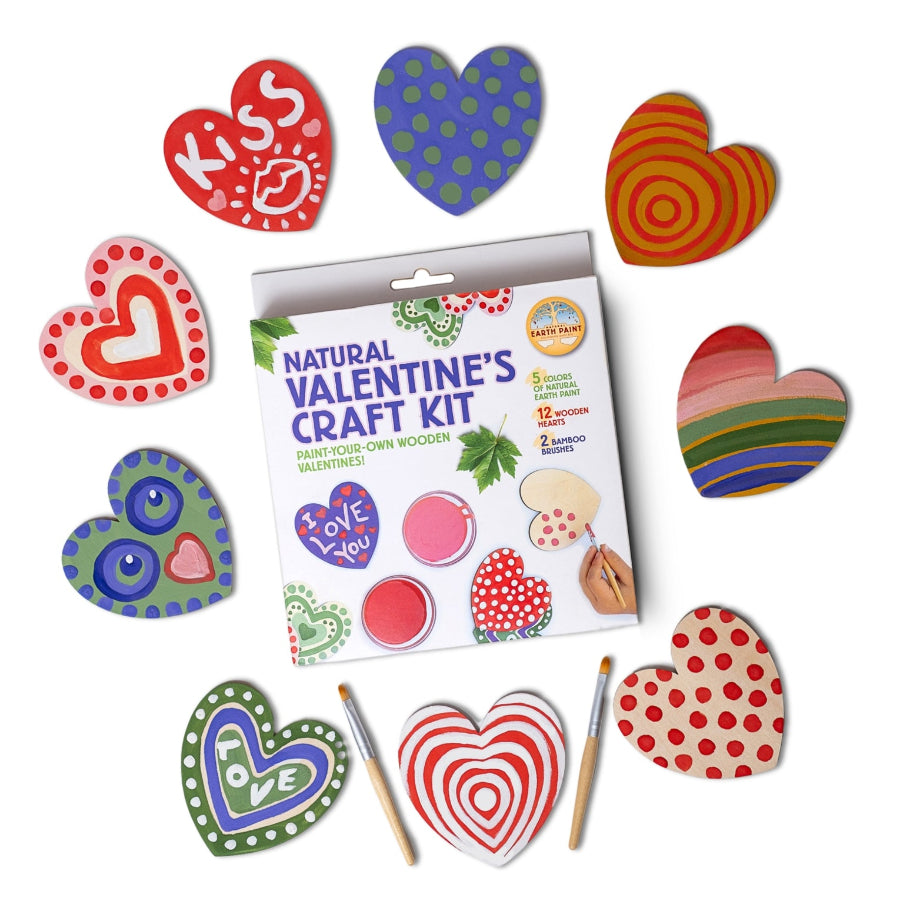 Valentine's craft kit with heart-shaped wooden pieces and paint supplies on a white background, made by natural earth paint