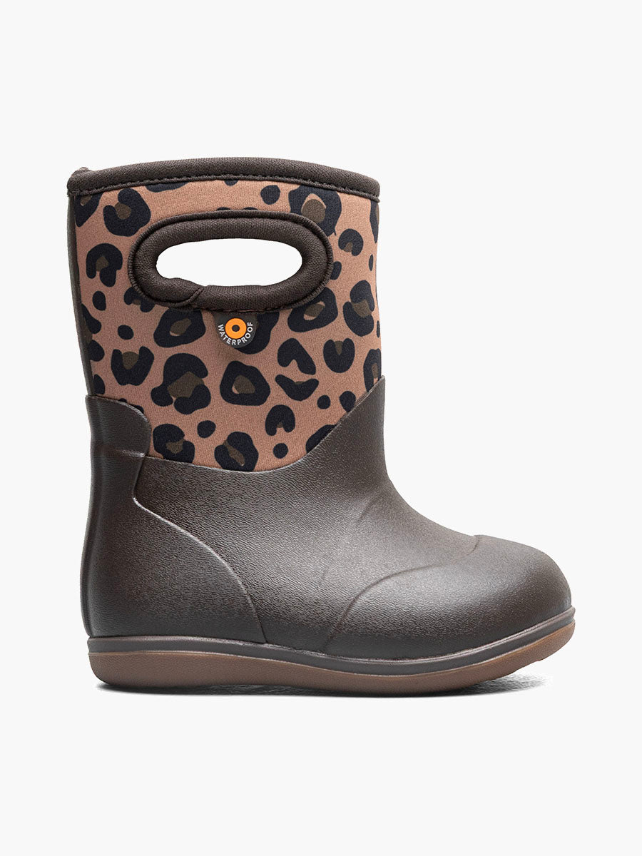A single toddler's winter boot in navy blue with a patterned upper featuring red and orange sea life motifs, a handle cutout, and a brown sole, shown against a plain white background. Made by Bogs brand, baby classic model