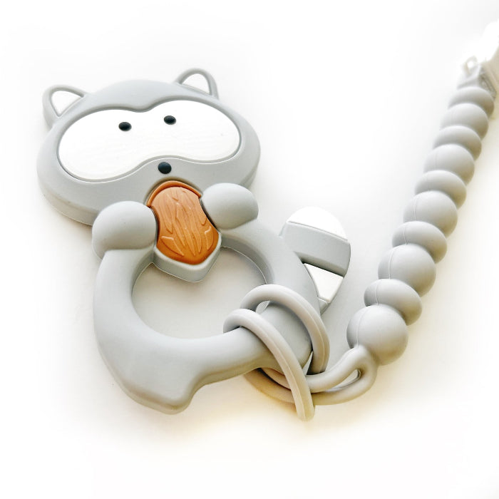 Two animal-themed silicone teething toys, one raccoon and one gray squirrel  with clips