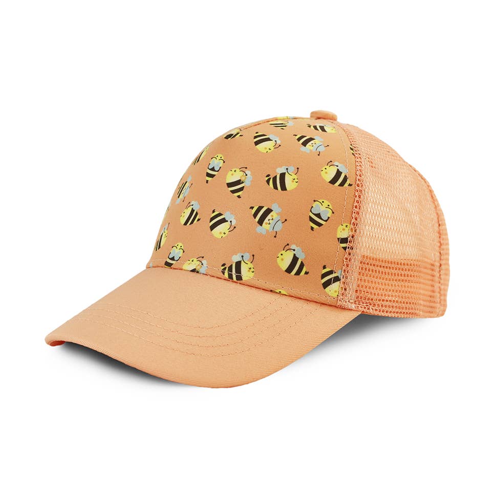 Peach-colored kids ball cap with bee pattern on a white background