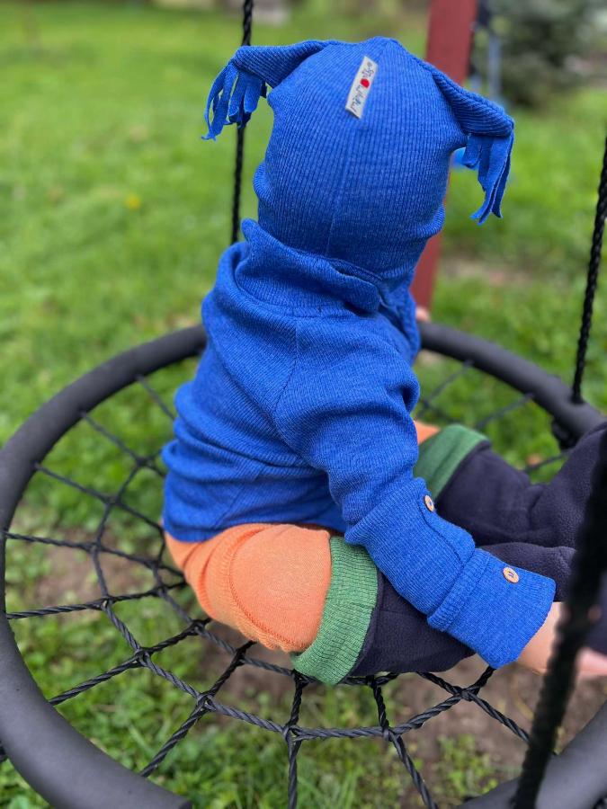 many months owl earflap beanie on a doll in elephant gray