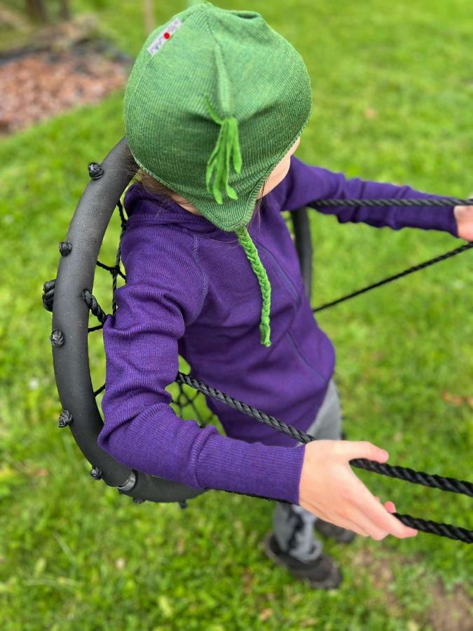 many months owl earflap beanie on a doll in elephant gray