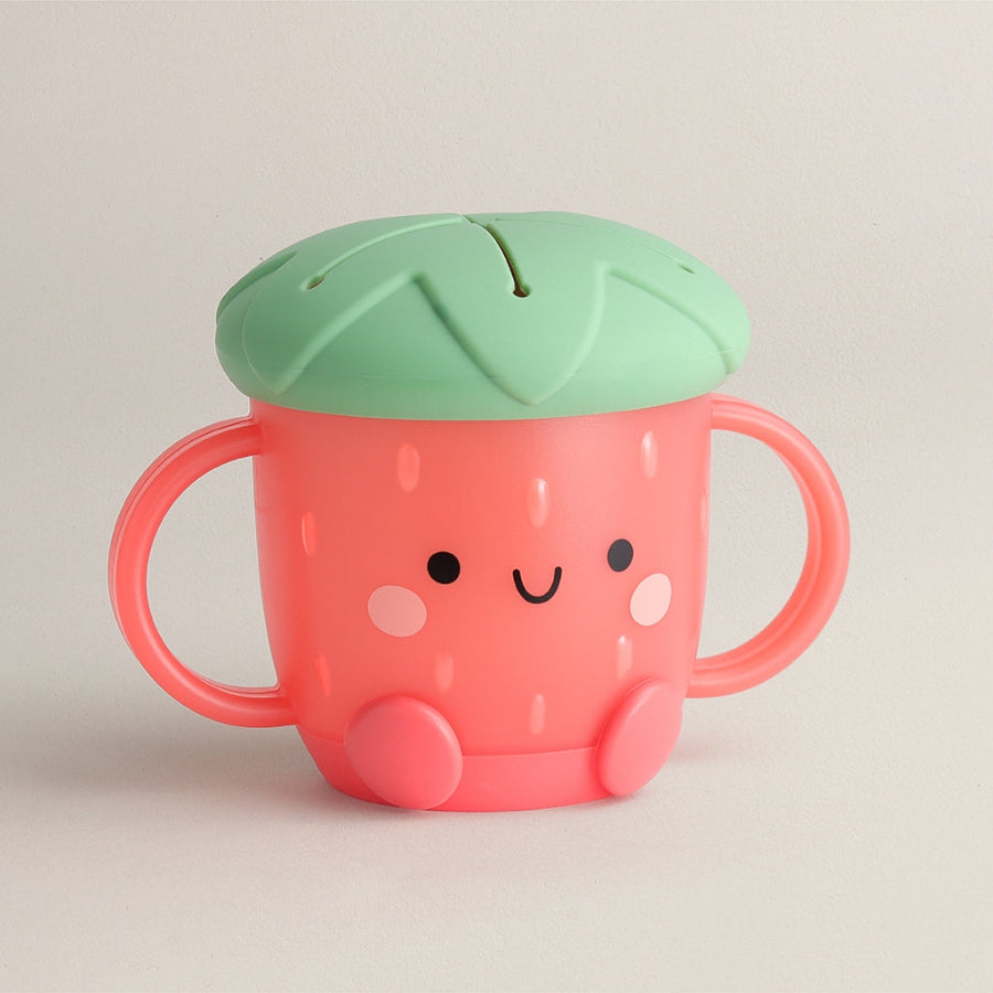 Children's snack cup with a red lid and cute face design on a beige background, mushroom theme, made by Itzy Ritzy brand