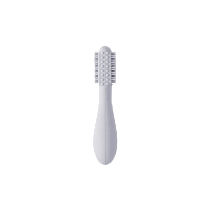 EZPZ brand baby led toothbrush, made from silicone with bristles and bumps, shown in sage green color