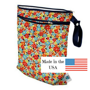 Planet Wise Wet/Dry Bag, Fancy Pants print, red, orange, yellow, and aqua mini flowers and made in the USA logo, measures 12.5" x 15.5" with 2 zippers
