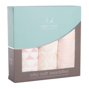 Aden and Anais silky soft muslin swaddle Metallic Primrose Birch collection with three swaddles featuring pastel prints in peach and pink designs