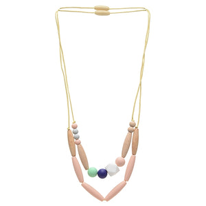 Metropolitan Necklace is great because it has two strands (we love the fashion of multiple strand necklaces!) with different bead selections on each, including a couple of natural wood beads and various sizes and shapes of silicone beads and can be worn separately or together as strands. . Shown in mint green and tan color scheme.