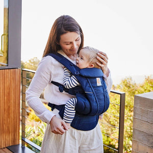 ergobaby omni breeze carrier in graphite grey with the ergo baby company logo