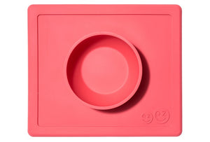 Happy Bowl by EZPZ, shown in coral red with pasta inside, made from silicone