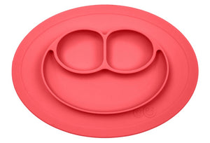 coral ezpz all in one mini mat that suctions to a table or highchair with food in the 3 compartments before mealtime