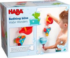 Packaging for the Haba Bathing Bliss Water Wonders bath toy, red watering can, water wheel with 3 colorful buckets, and a funnel