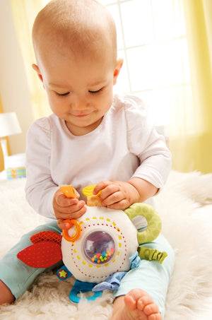 All the colors of the rainbow are featured on the soft HABA cuddly rainbow round teether