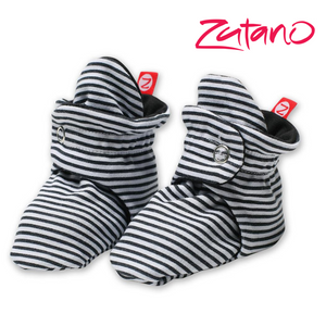 zutano logo and a pair of black and white stripe zutano booties made from 100% organic cotton interlock